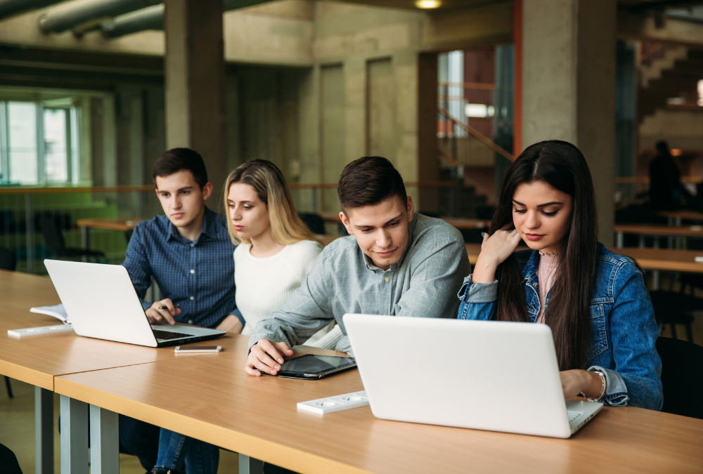 People learning at a desk.